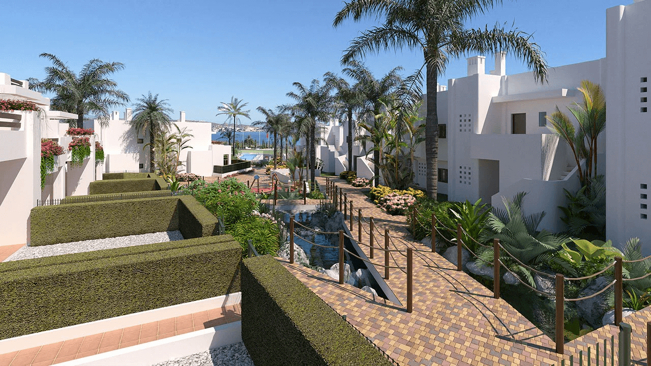 Bungalows bajos de 3 dormitorios y 2 baños con parking en sótano y piscina comunitaria en primera línea de la playa